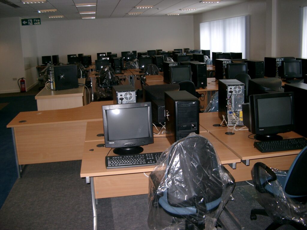 A classroom full of new computers being setup