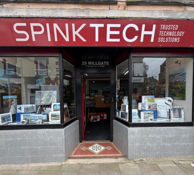 A shopfront with an open door in the centre of the frontage